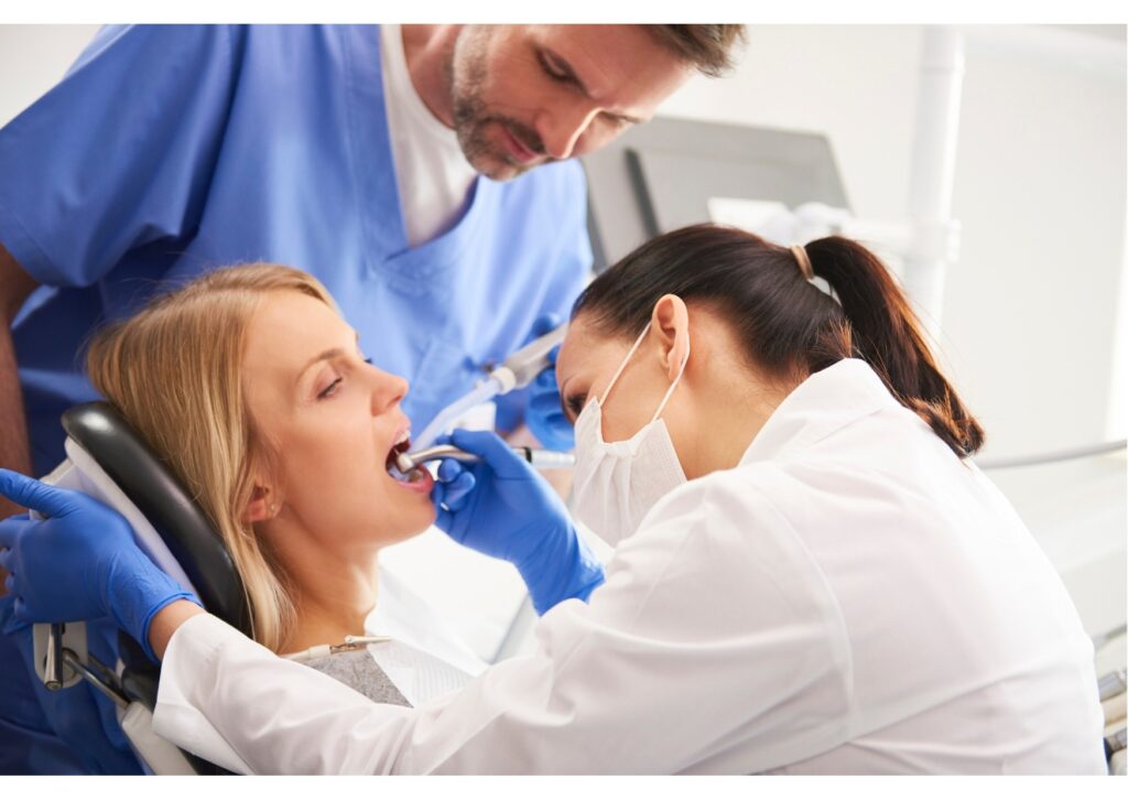 Dental team performing an implant consultation and treatment related to dental implant cost planning